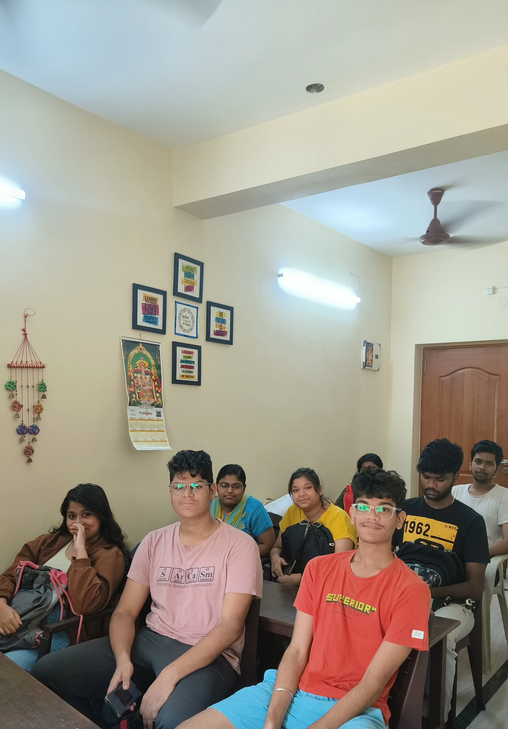 Students using the Sri Guru learning portal on a laptop
